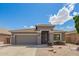 Charming single-story home featuring a low maintenance desert landscape, covered entry and two car garage at 81 E Rock Wren Dr, San Tan Valley, AZ 85143