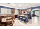 Well-lit kitchen with granite countertops, central island, and stainless steel appliances at 81 E Rock Wren Dr, San Tan Valley, AZ 85143