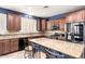 Kitchen with granite countertops, central island, stainless steel appliances, and tiled backsplash at 81 E Rock Wren Dr, San Tan Valley, AZ 85143