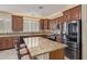 This kitchen features granite counters, stainless steel appliances, and a large island for ample workspace at 81 E Rock Wren Dr, San Tan Valley, AZ 85143