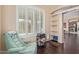 Bright office space features a large window, comfortable seating and view of kitchen through an arched doorway at 81 E Rock Wren Dr, San Tan Valley, AZ 85143