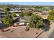 Stunning aerial of a home surrounded by lush trees in a charming neighborhood at 8228 E Oak St, Scottsdale, AZ 85257