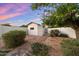 Private backyard with a charming shed, brick path and mature foliage at 8228 E Oak St, Scottsdale, AZ 85257