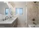 Elegant bathroom with double sinks, granite counters, and tiled shower at 8228 E Oak St, Scottsdale, AZ 85257