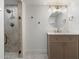 Neutral bathroom featuring a glass shower, marble tiling, and a stylish vanity at 8228 E Oak St, Scottsdale, AZ 85257