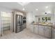 A kitchen featuring stainless steel appliances, granite countertops, an island, and a pantry at 8228 E Oak St, Scottsdale, AZ 85257