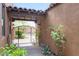 Private gated courtyard featuring desert landscaping that leads to a garden at 8512 E Gilded Perch Dr, Scottsdale, AZ 85255