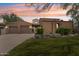 Charming single-story home featuring a well-manicured front yard, terracotta roof, and two-car garage at 8512 E Gilded Perch Dr, Scottsdale, AZ 85255