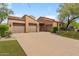Charming single-story home featuring a well-manicured front yard and a convenient three-car garage at 8512 E Gilded Perch Dr, Scottsdale, AZ 85255