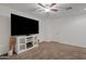Bright bedroom boasts ceiling fan, and built in white entertainment center at 854 S San Marcos Dr # A12, Apache Junction, AZ 85120