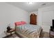 Comfortable bedroom showcasing vintage dresser, quilted bedspread, and soft carpeting at 854 S San Marcos Dr # A12, Apache Junction, AZ 85120