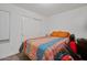 Modest bedroom includes white sliding door closet, and carpeted flooring at 854 S San Marcos Dr # A12, Apache Junction, AZ 85120