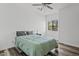 Well-lit bedroom with ample space, hard surface floors, ceiling fan, and a cozy ambiance at 854 S San Marcos Dr # A12, Apache Junction, AZ 85120