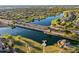 Wide aerial of community lake featuring a bridge and the covered gazebo area at 880 E Wimpole Ave, Gilbert, AZ 85297