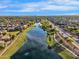 Expansive aerial view of a community with a long lake and tree-lined walking paths at 880 E Wimpole Ave, Gilbert, AZ 85297