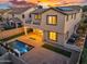 Aerial view of backyard oasis: sparkling pool, covered patio, turf, pavers, and white fence at 880 E Wimpole Ave, Gilbert, AZ 85297