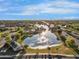 Scenic aerial view of community lake featuring a fountain and lush green landscaping at 880 E Wimpole Ave, Gilbert, AZ 85297
