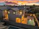 Aerial view of the house showcasing a backyard pool, patio, turf, mountain views, and great curb appeal at 880 E Wimpole Ave, Gilbert, AZ 85297