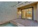 Cozy back patio area with brick pavers, colorful string lights, and easy access to the home's interior at 880 E Wimpole Ave, Gilbert, AZ 85297