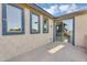Balcony exterior featuring stucco with sliding glass door and iron railing at 880 E Wimpole Ave, Gilbert, AZ 85297