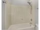 Bathroom features a shower and tub combination with white tile surround and chrome fixtures at 880 E Wimpole Ave, Gilbert, AZ 85297