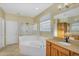 Beautiful bathroom with dual vanities, soaking tub and separate shower at 880 E Wimpole Ave, Gilbert, AZ 85297