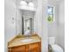 This lovely bathroom features a vanity with granite countertops and plenty of natural light at 880 E Wimpole Ave, Gilbert, AZ 85297
