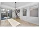 Bright dining space offering tile floors, backyard view, and stair access at 880 E Wimpole Ave, Gilbert, AZ 85297