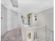 Bright hallway with carpet floors and views to different rooms. Modern design and neutral paint at 880 E Wimpole Ave, Gilbert, AZ 85297