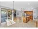 Open kitchen with custom cabinetry, granite counters, stainless steel appliances, and seamless access to living spaces at 880 E Wimpole Ave, Gilbert, AZ 85297
