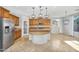 Inviting kitchen featuring a breakfast bar and stainless steel appliances at 880 E Wimpole Ave, Gilbert, AZ 85297