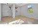 Bright living room features tile flooring, fresh paint, and well-lit windows at 880 E Wimpole Ave, Gilbert, AZ 85297