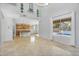 Bright living room showcasing tile floors and a view of the pool, connecting the indoor and outdoor spaces at 880 E Wimpole Ave, Gilbert, AZ 85297