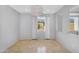 Bright living room features tile flooring, fresh paint, and well-lit windows at 880 E Wimpole Ave, Gilbert, AZ 85297