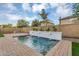 Stunning pool with water feature and lush landscaping at 880 E Wimpole Ave, Gilbert, AZ 85297