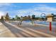 Community splash pad complete with playful water features, colorful arches, and shaded seating areas at 880 E Wimpole Ave, Gilbert, AZ 85297