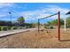 Community swing set surrounded by mature landscaping and a well-maintained wood chip surface at 880 E Wimpole Ave, Gilbert, AZ 85297