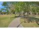 Scenic community walking path lined with mature trees, providing a peaceful and shaded environment at 880 E Wimpole Ave, Gilbert, AZ 85297
