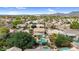 This aerial view showcases a home with a private pool and covered patio in a lush community at 9225 E Pine Valley Rd, Scottsdale, AZ 85260