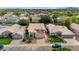 Street view of the home featuring well-manicured landscaping and a view of the surrounding neighborhood at 9225 E Pine Valley Rd, Scottsdale, AZ 85260