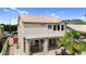 Beautiful backyard showcasing a covered patio and comfortable seating area with desert landscaping at 9225 E Pine Valley Rd, Scottsdale, AZ 85260