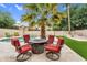 Beautiful backyard with a pool, desert landscaping, and a fire pit seating area at 9225 E Pine Valley Rd, Scottsdale, AZ 85260