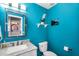 Colorful bathroom with quartz counters, modern fixtures, and framed mirror offers functional style at 9225 E Pine Valley Rd, Scottsdale, AZ 85260