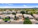 Charming two-story home featuring a tile roof, well-manicured lawn, and attached two-car garage at 9225 E Pine Valley Rd, Scottsdale, AZ 85260