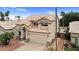 Beautiful two-story home with a tile roof, two-car garage, and desert landscaping in a residential neighborhood at 9225 E Pine Valley Rd, Scottsdale, AZ 85260