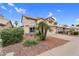 Charming two-story home featuring a two-car garage and desert landscaping at 9225 E Pine Valley Rd, Scottsdale, AZ 85260