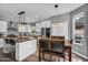 Modern kitchen featuring an island with barstool seating and stainless steel appliances at 9225 E Pine Valley Rd, Scottsdale, AZ 85260