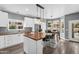 Open kitchen with wood countertops, stainless appliances, an island, and views to the outdoor patio at 9225 E Pine Valley Rd, Scottsdale, AZ 85260