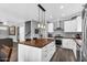 Spacious kitchen with butcher block island, stainless appliances and lots of cabinet space at 9225 E Pine Valley Rd, Scottsdale, AZ 85260