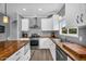 A well-lit kitchen features stainless steel appliances and butcher block countertops at 9225 E Pine Valley Rd, Scottsdale, AZ 85260